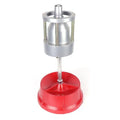 Portable aluminium hub balancer with bull's eye level on a red enamel-finished base.