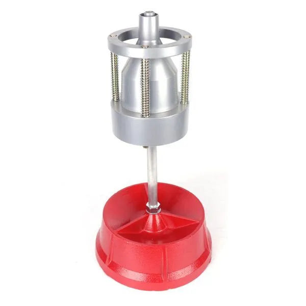 Portable aluminium hub balancer with bull's eye level on a red enamel-finished base.