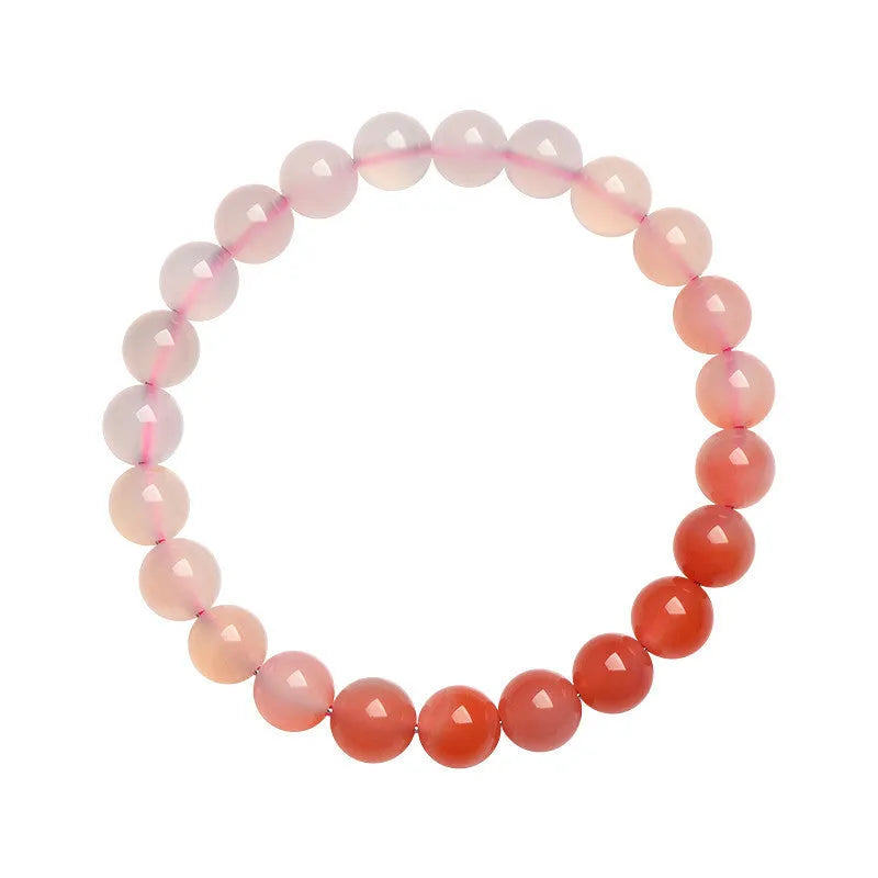 Natural gradient Yanyuan agate bracelet with geometric beads in salt source colour on a white background