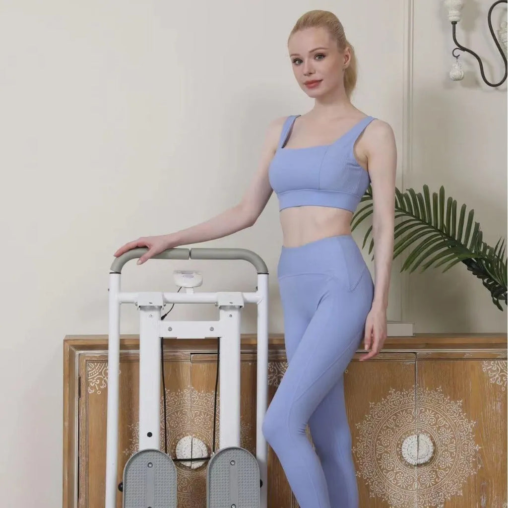 White foldable treadmill with integrated climbing frame for home fitness exercises