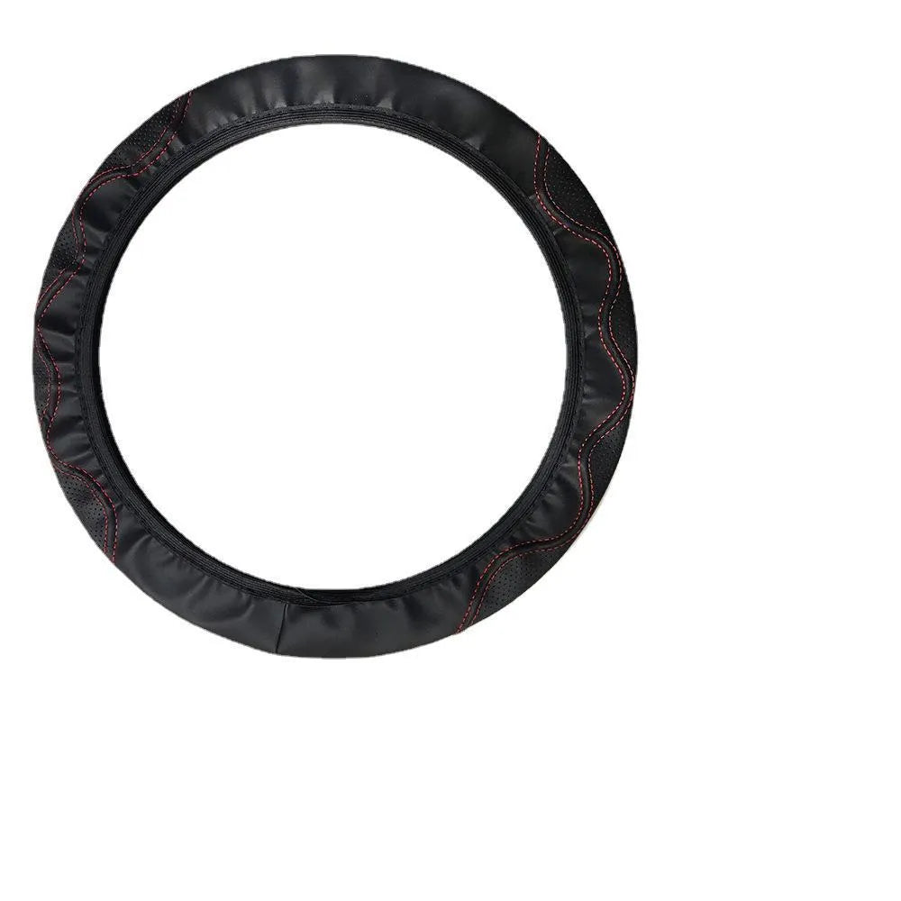 Black embossed corrugated elastic steering wheel cover shown fitted on a car steering wheel.
