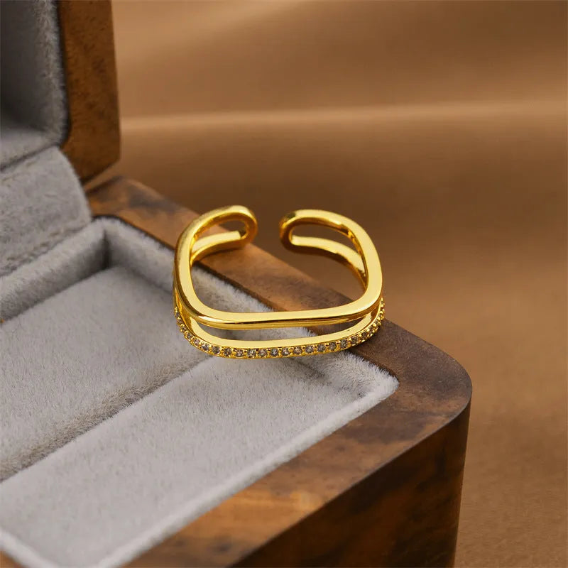 Geometric open women's ring in electroplated gold colour made from copper material