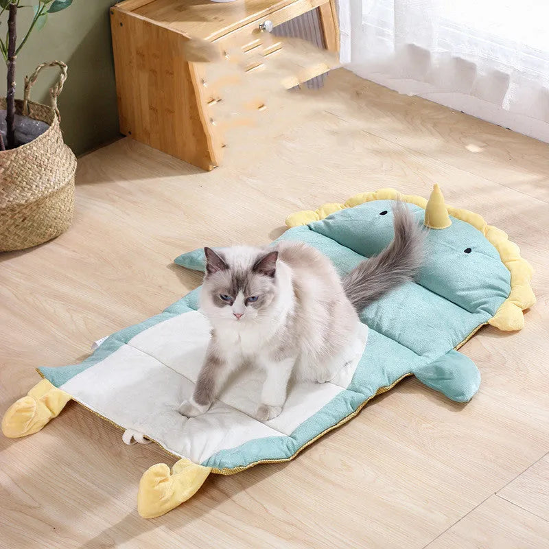 Detachable cool cat bed with ice pad in Green Dinosaur pattern on a indoor surface