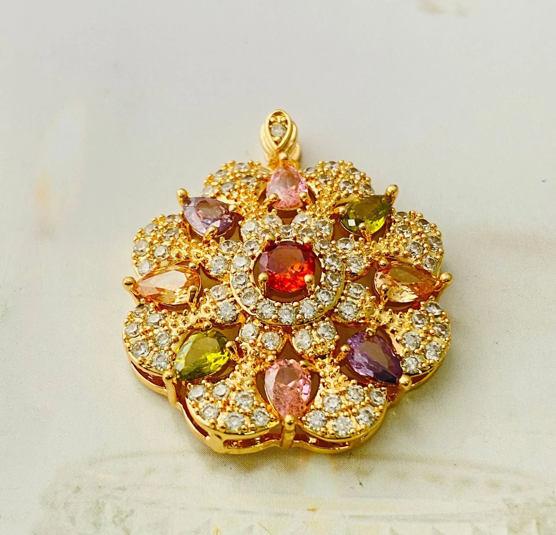 Women's flower-shaped zircon pendant necklace in gold tone on a model.