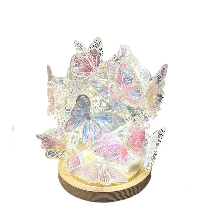 Butterfly night lamp with glass shade on raw wood base, measuring 12x15cm