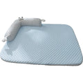 Blue pet cooling mat with big-eyed monster design on a wooden floor, shown in large (L) size.