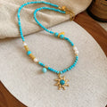 Freshwater pearl necklace with geometric stone sun pendant on clavicle chain