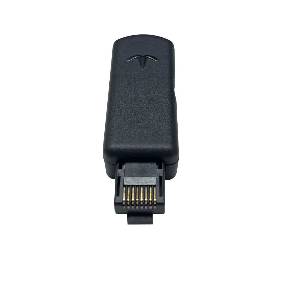 Black aluminium alloy PS4 USB firmware tool with data cable on a dark surface.