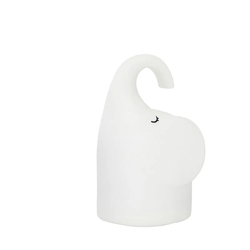 DOMI elephant-shaped silicone night light with dimmer control on bedside table