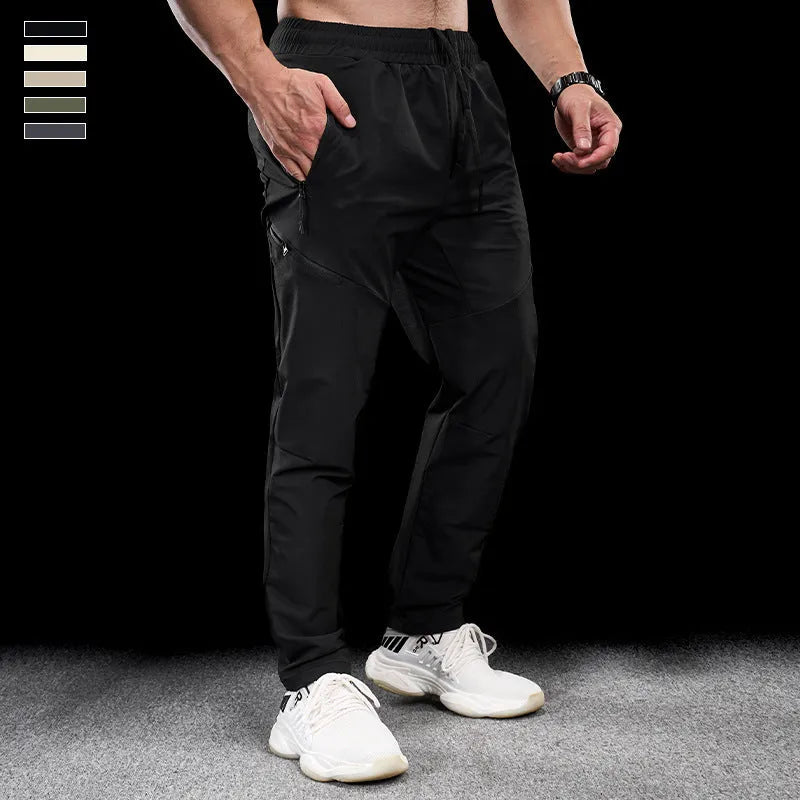 Men's black waterproof quick-drying nylon workout trousers for sports and exercise