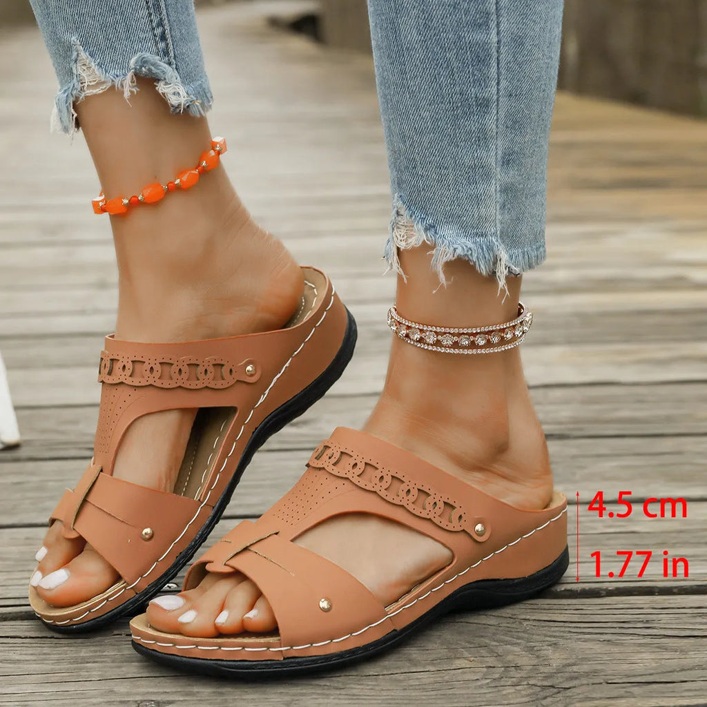 Roman style slippers showing heel slope design and fish mouth toe in beige colour on rubber sole