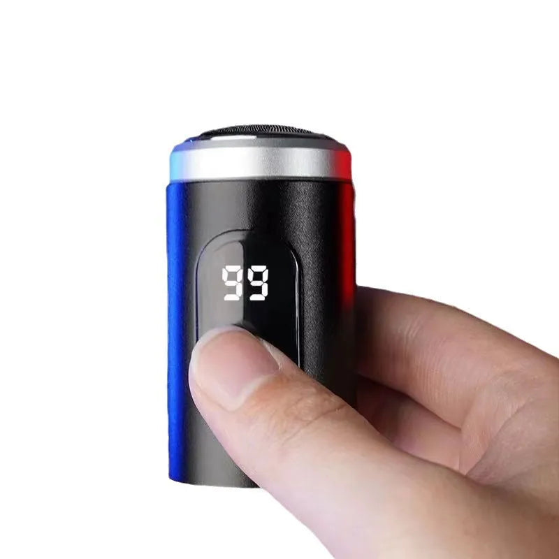 Black portable rechargeable shaver with USB charging cable and cleaning brush on a white background.