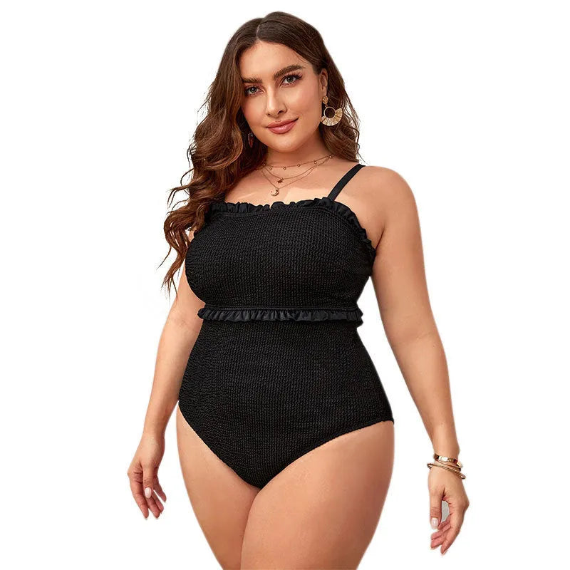 Black plus size one-piece swimsuit with double shoulder straps and a briefs style bottom.