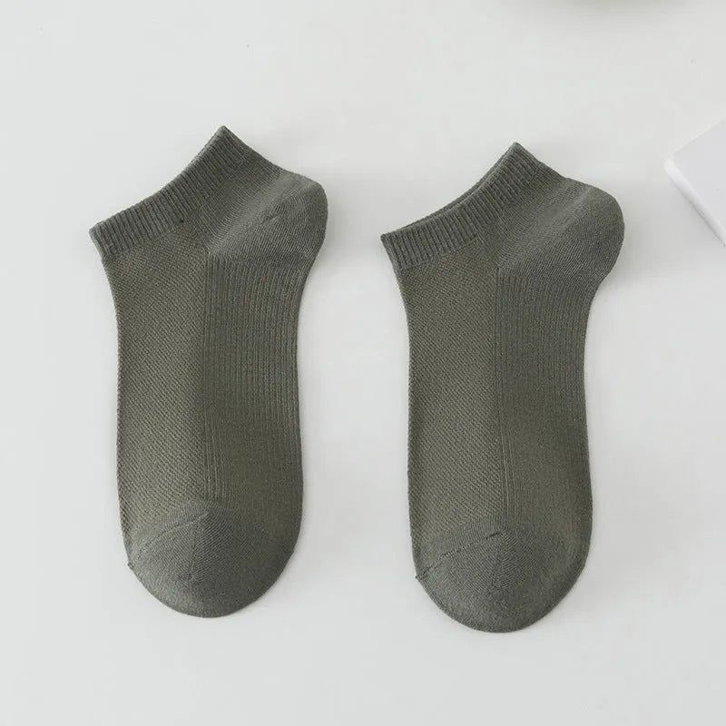 Men's solid colour polyester low-cut boat socks shown in one of six available colour options