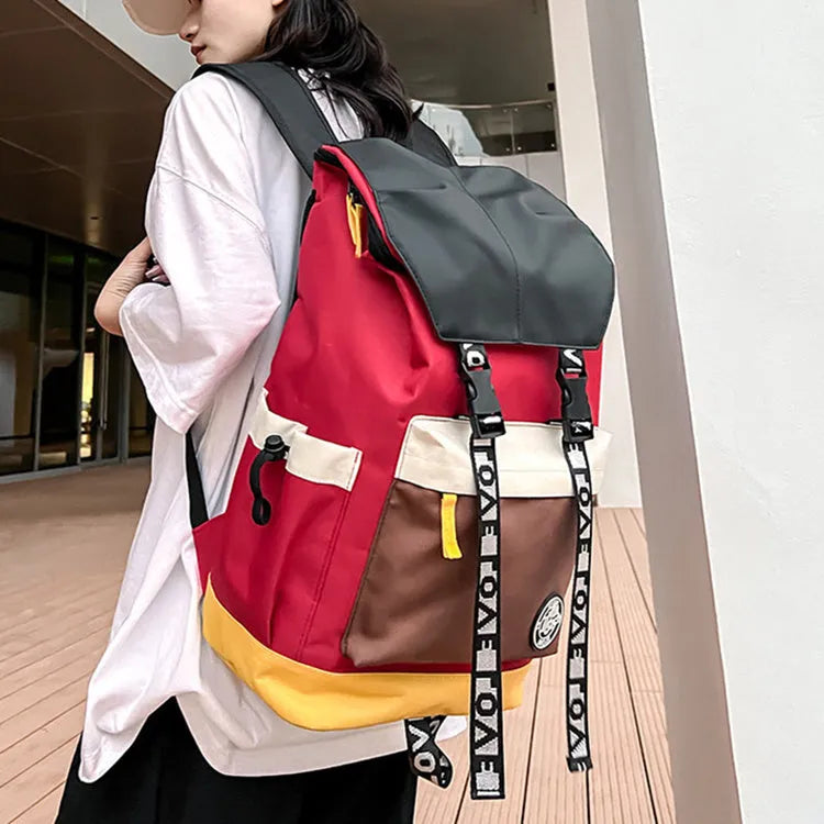 Oxford cloth backpack in black, green, or red with handheld grip and shoulder straps.