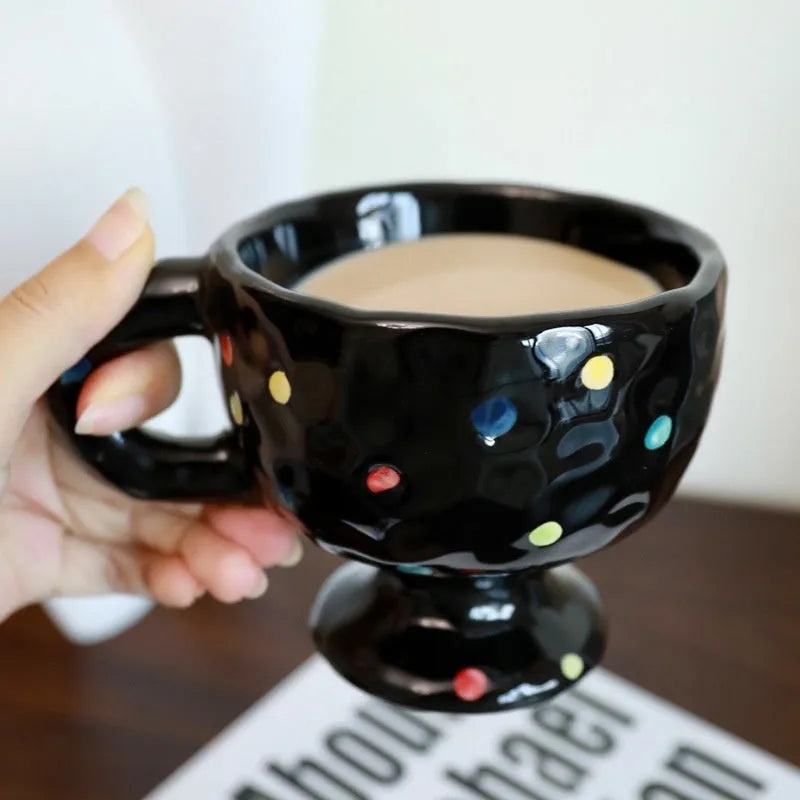Hand-pinched irregular ceramic mug with modern minimalist design in solid colour