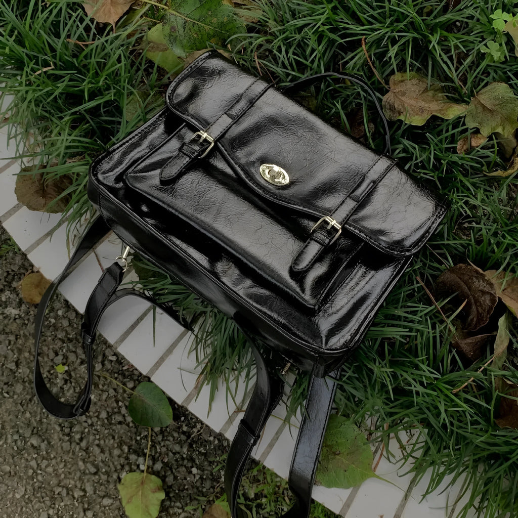 Black college messenger bag with oil wax PU leather finish showing dimensions 35cm length