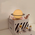 Moon Earth maglev floating LED night light with levitating planet and astronaut figurines on base
