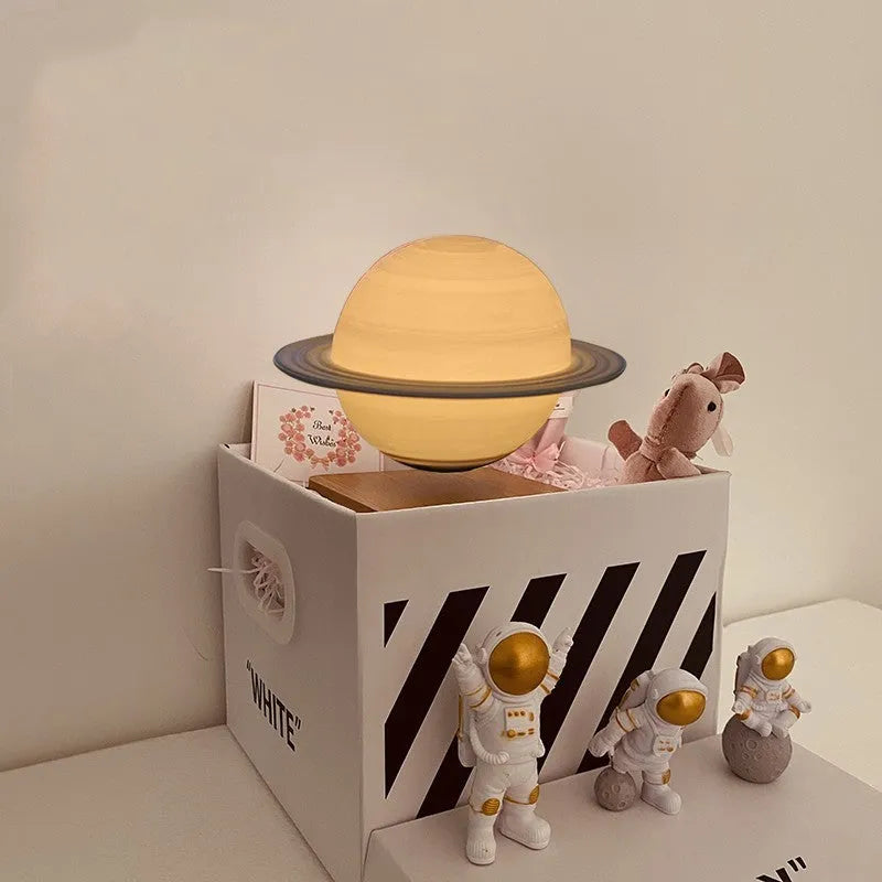 Moon Earth maglev floating LED night light with levitating planet and astronaut figurines on base