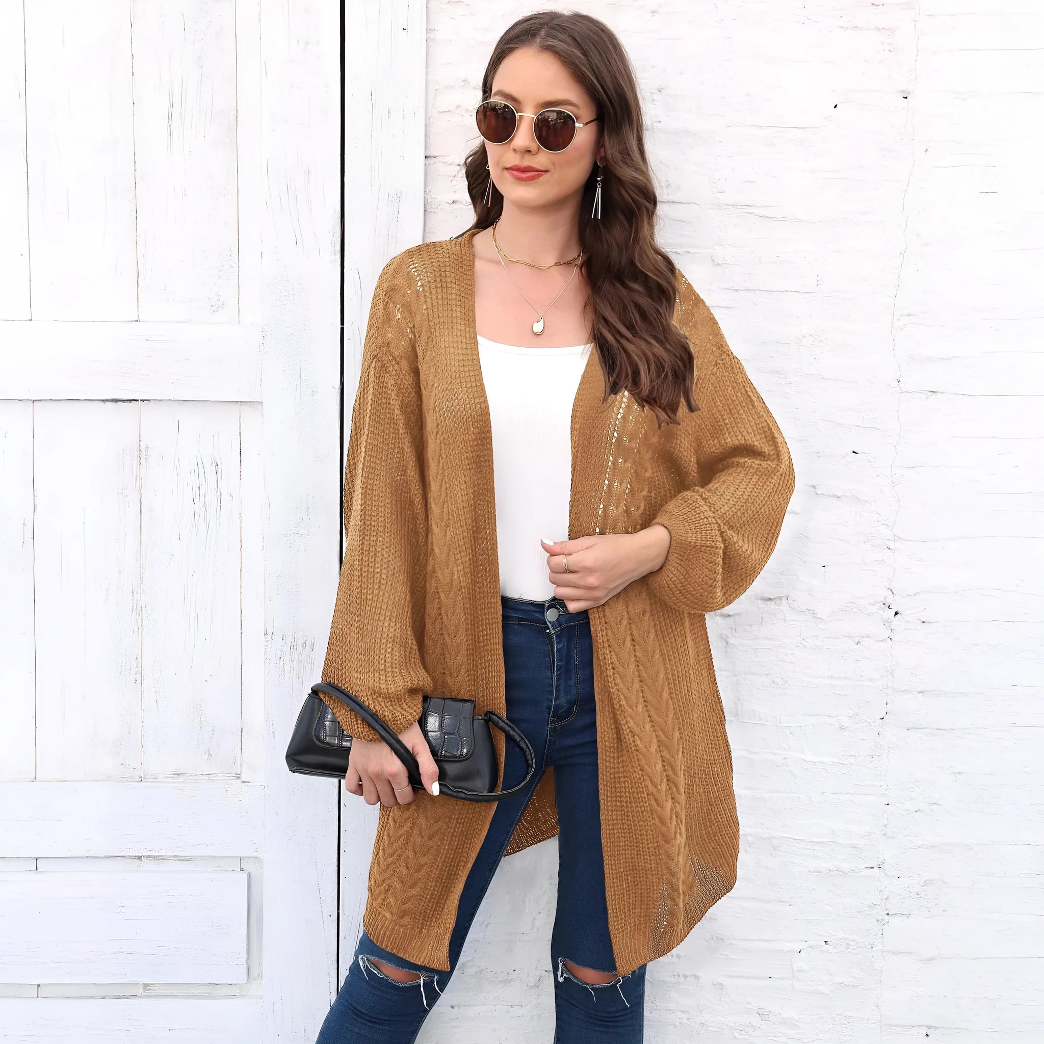 Women's loose acrylic sweater coat in army green, shown as a layering piece.