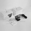 Black 8MP USB webcam with a magnetic privacy cover attached, shown next to its cable and manual.