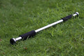 Steel adjustable pull-up bar mounted in a door frame for home fitness workouts