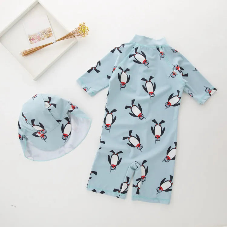 Boys' penguin print long sleeve one-piece swimsuit with matching swimming cap set.