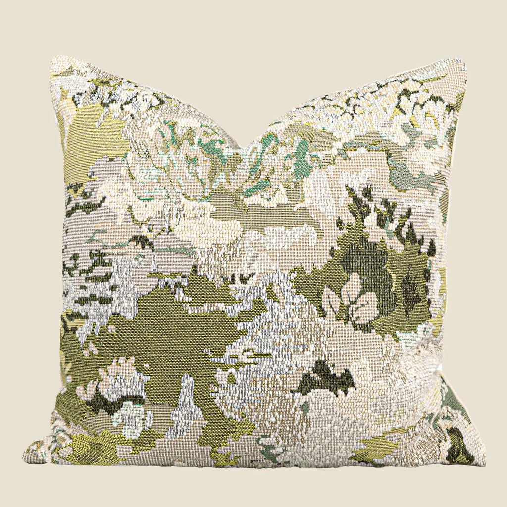 Green abstract floral wool blend decorative cushion on a neutral background.
