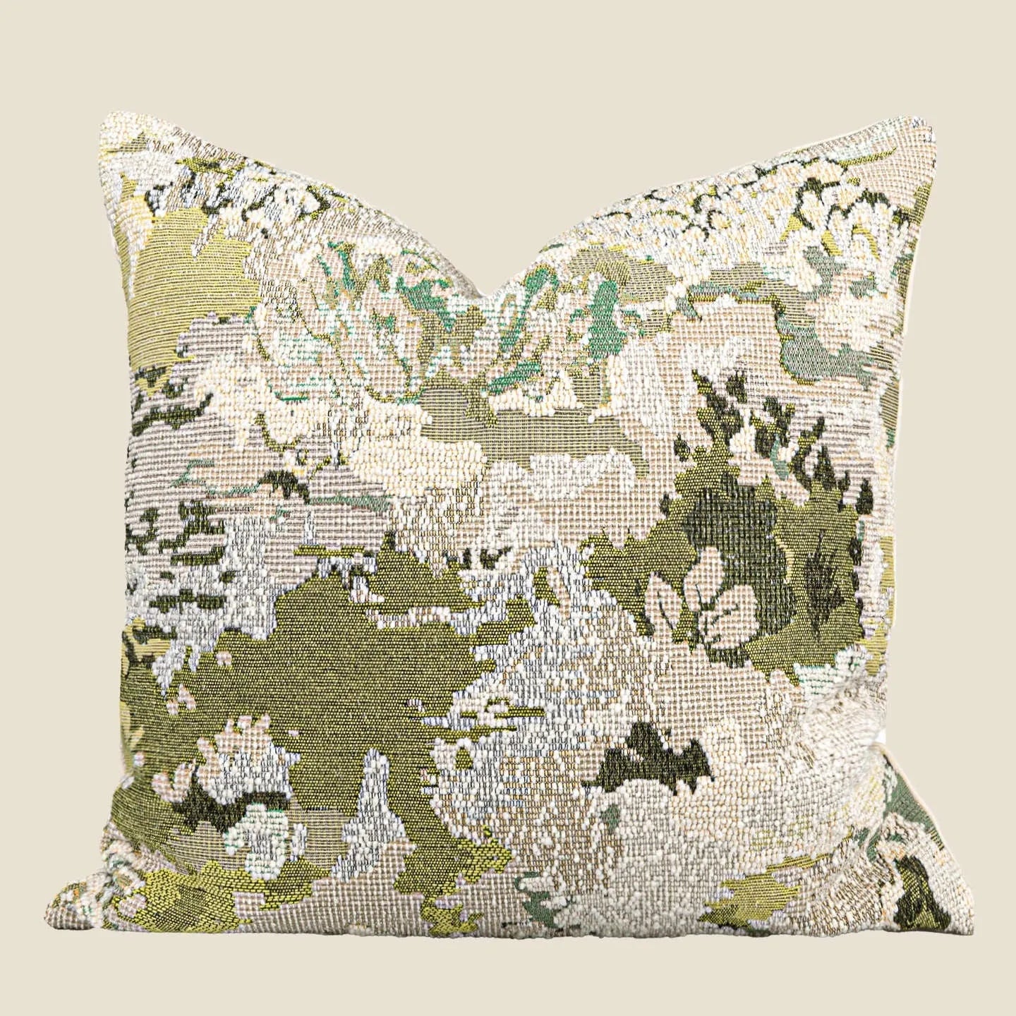 Green abstract floral wool blend decorative cushion on a neutral background.
