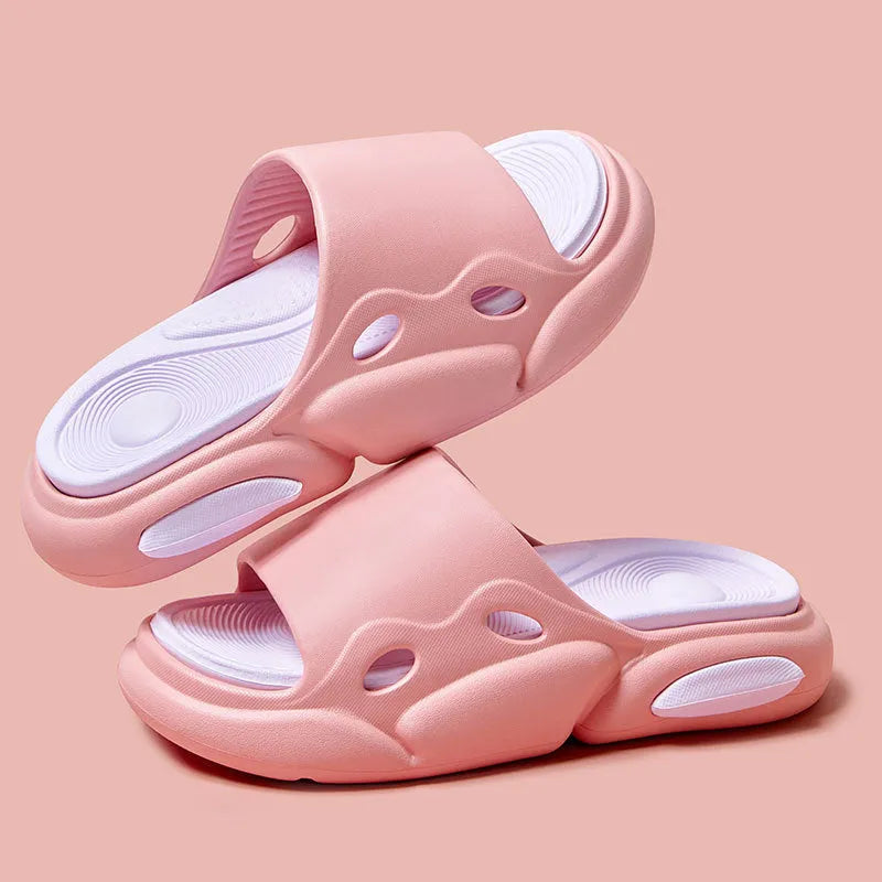 Two-colour EVA couples slippers with thick sole and leather lining in pink purple, shown from the side.