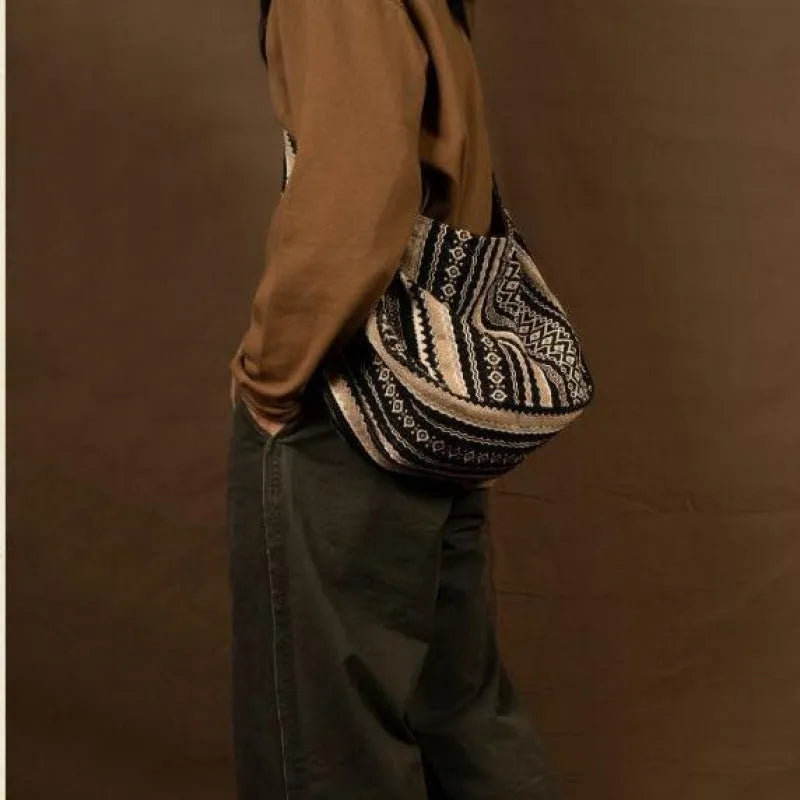 Retro striped corduroy messenger bag with adjustable plaid shoulder strap and zipper closure