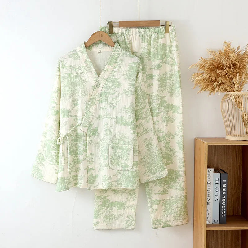 Women's pink cotton gauze long sleeve top and trousers matching loungewear set laid flat.