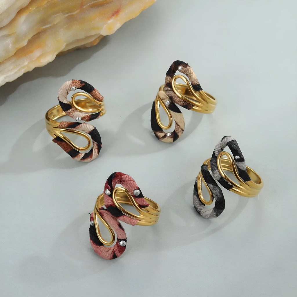 Geometric stainless steel open mouth ring with leopard print patterns in heart and star shapes
