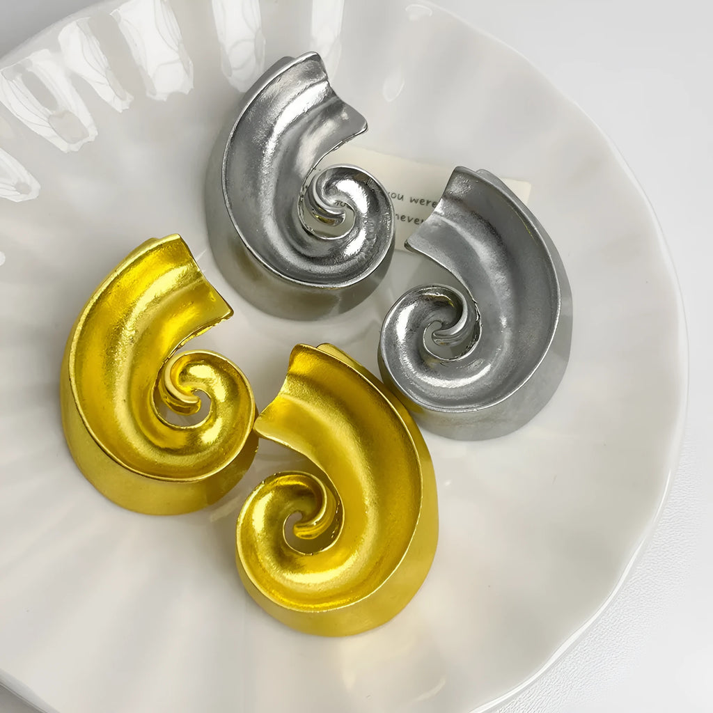 Geometric drop ear studs with retro design in gold or silver finish measuring 5cm length