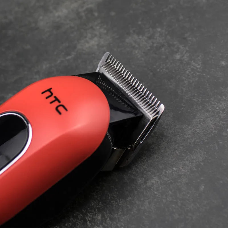 Professional digital hair clipper in black, red, or white with 4 limiting combs, charger, and cleaning tools.