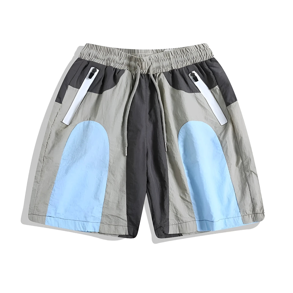 Blue men's loose patchwork quick-drying sports shorts with straight legs and elasticated waist.