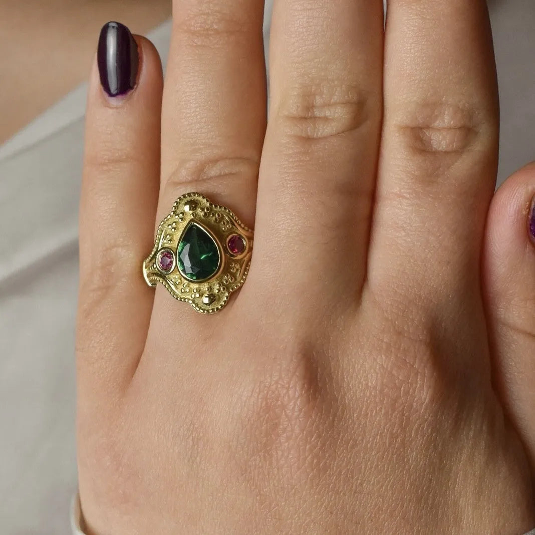 Women's gold-plated geometric ring with electroplated golden lvzuan finish showing side view