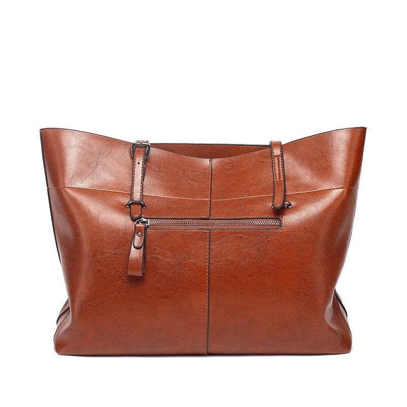 Brown waxed cowhide leather crossbody handbag showing two compartments and phone pocket