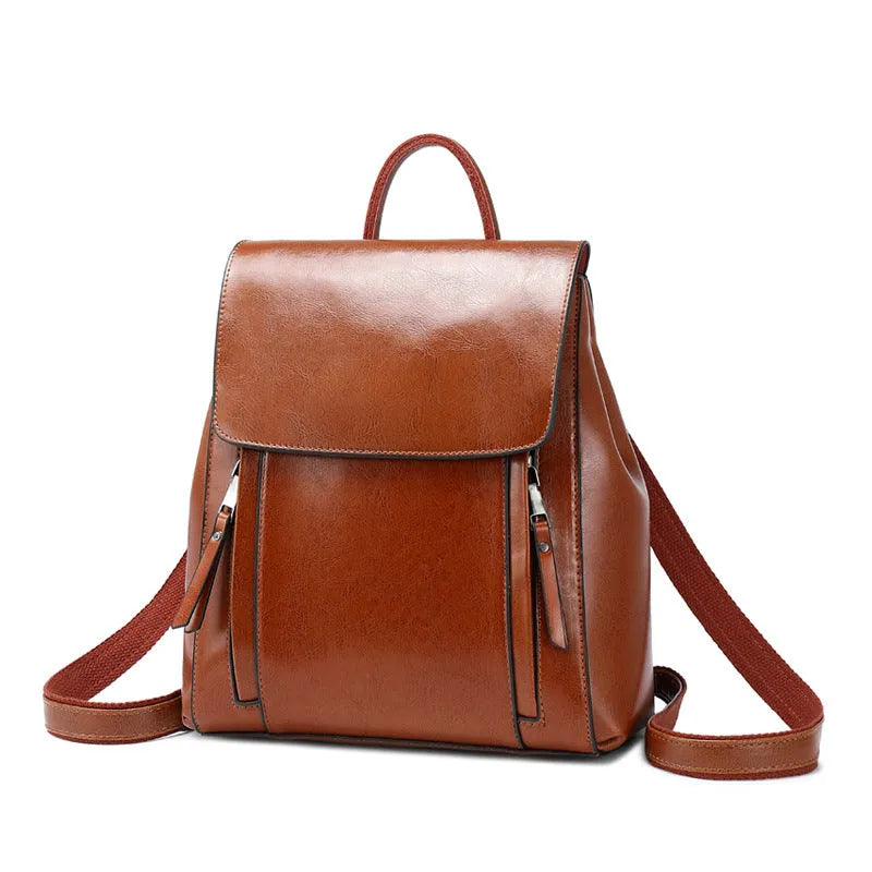 Large genuine leather women's backpack in black with stitching detail and dual straps.