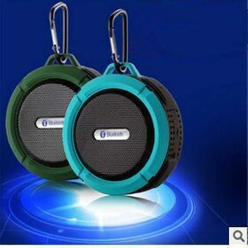 Waterproof portable Bluetooth speaker in multiple colours with mountaineering buckle attachment