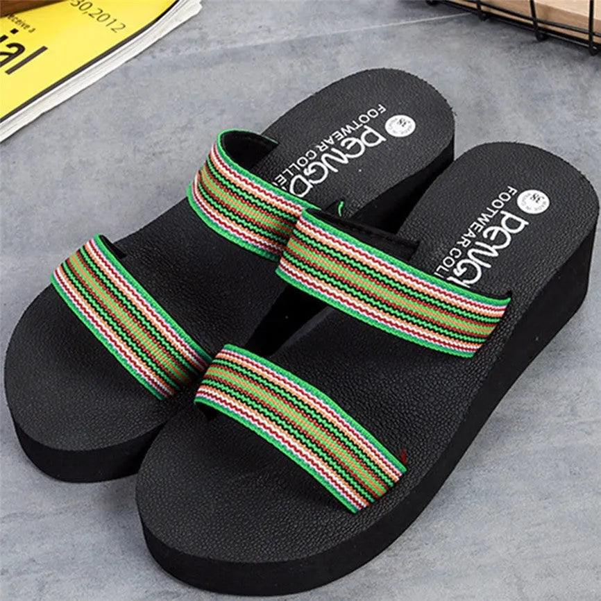 Women's brown bohemian summer slippers with a raised heel on a rubber sole.