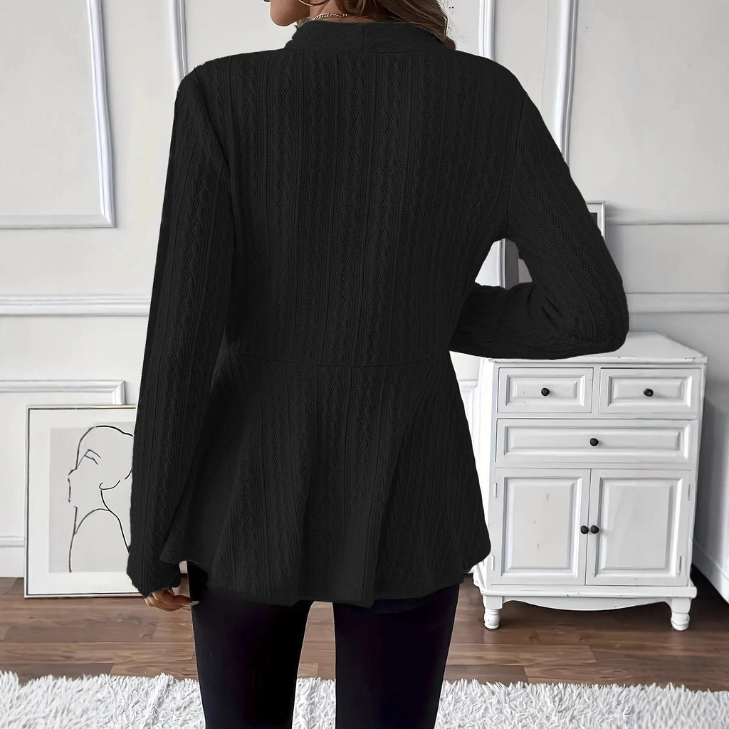 Women's apricot tight-fit Jacquard knitted cardigan with one button on a hanger.