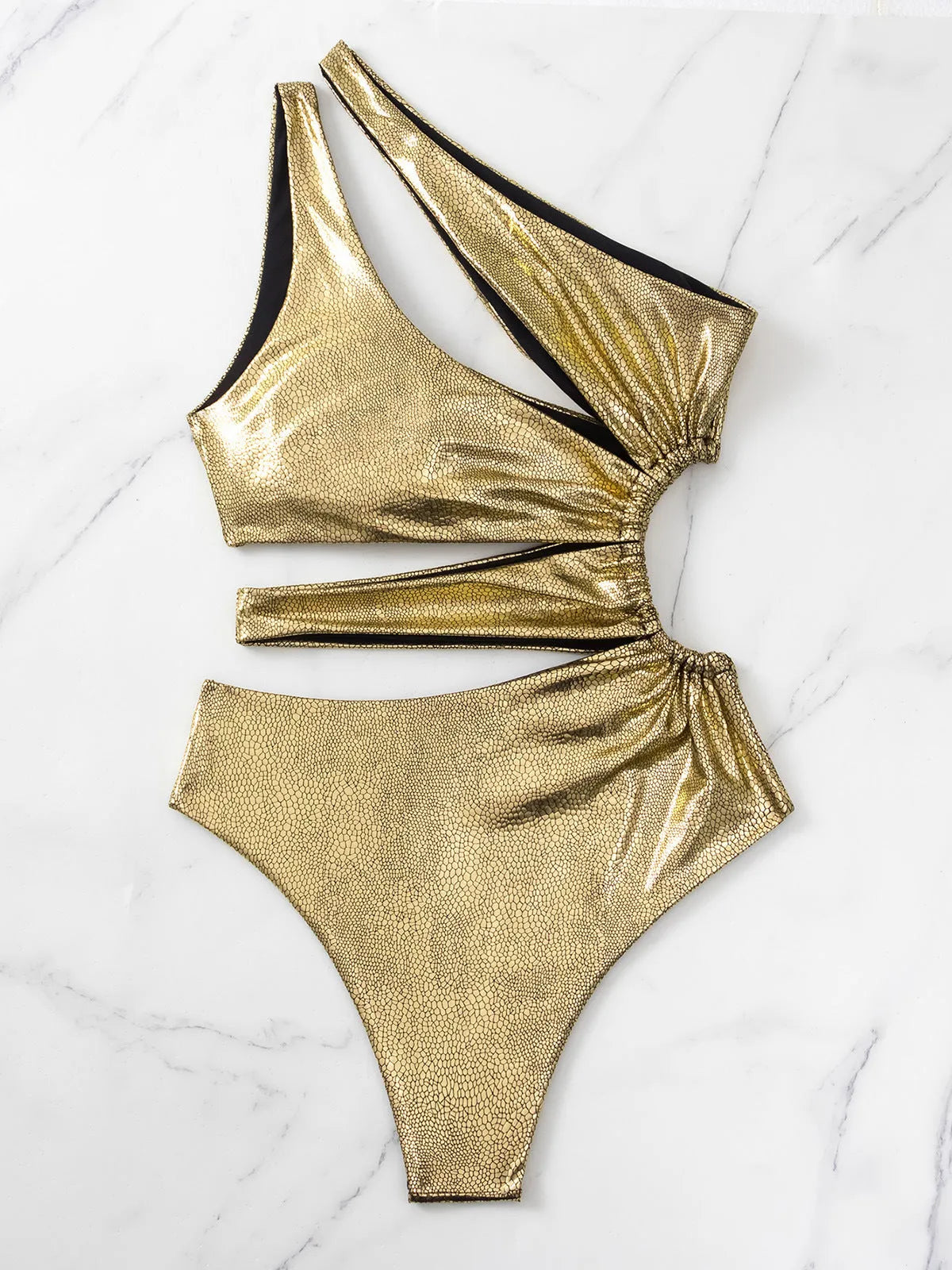 Women's C3177 gold backless one-piece swimsuit on a white background.