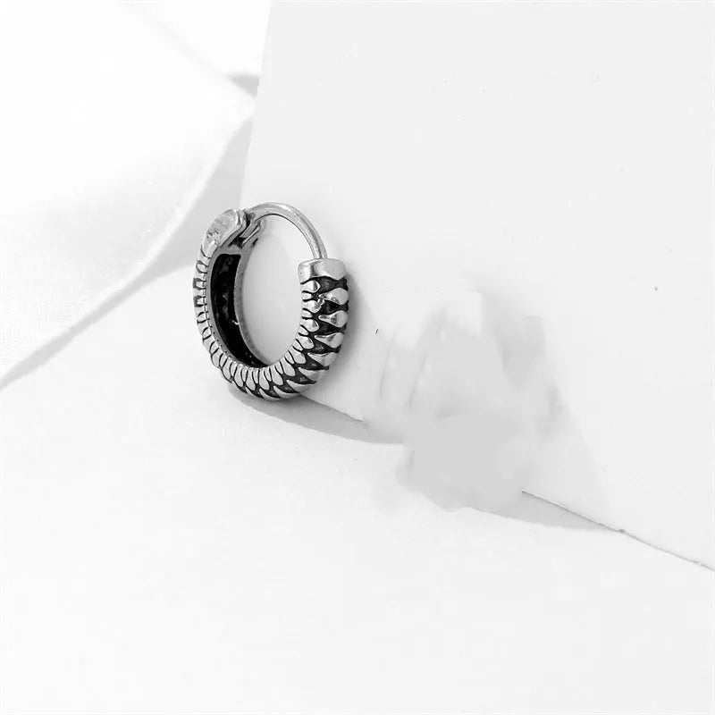 Silver geometric retro twist earrings with stripe detail, made from titanium steel.