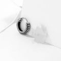 Silver geometric retro twist earrings with stripe detail, made from titanium steel.