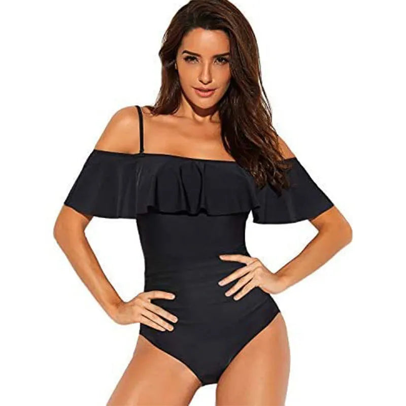 Black one-piece swimsuit with cut-out detail and ruffled straps on a tube top.