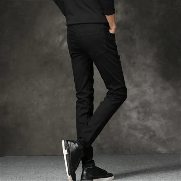 Slim-fit stretch cotton men's pants in black, laid flat showing tight cut and full length