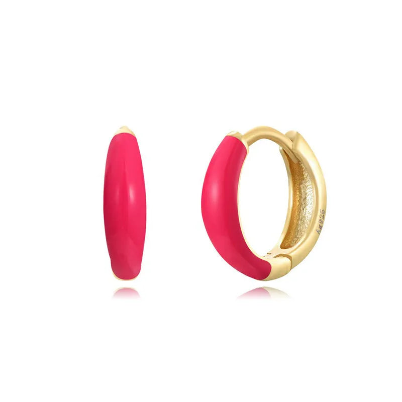 Geometric U-shaped epoxy earrings with a dripping oil finish in various colours.