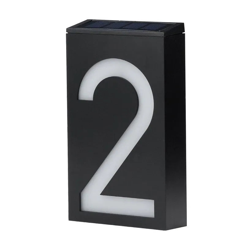 Solar powered house number light with LED illumination and waterproof housing for outdoor installation