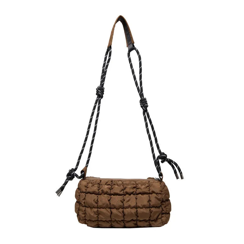 Soft pillow-shaped nylon messenger bag in multiple colours with a single shoulder strap.